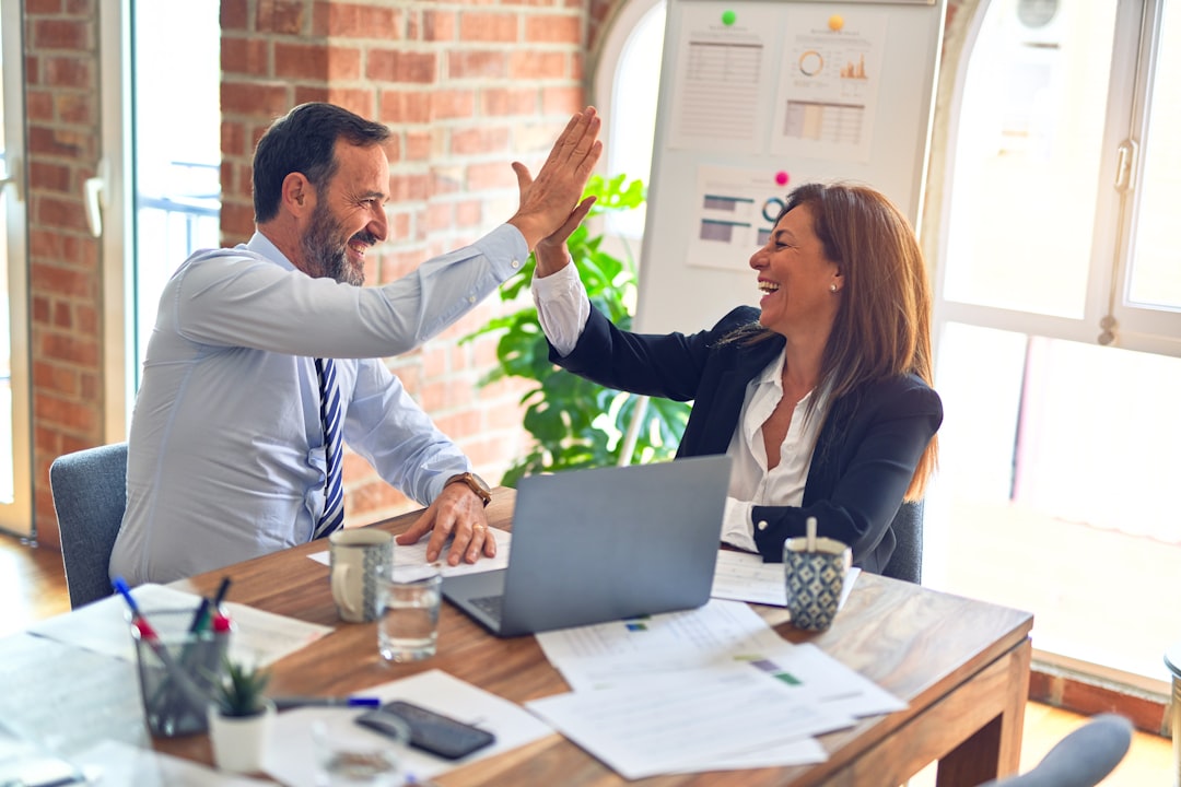 Team celebrating results during a meeting